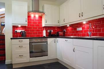 The stylish kitchen is fully equipped and provides all you require for self-catering.