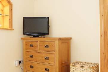 There is a television in the bedroom.