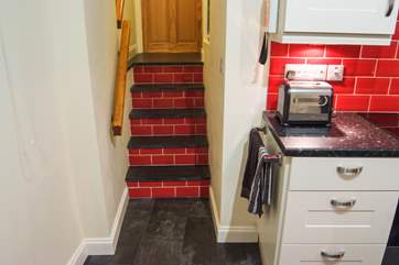 The bedroom and wet-room are up a short flight of five steps.
