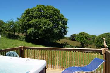 The fabulous hot tub, on the sunny raised deck at the back of the cottage, is very private and has lovely countryside views.