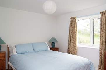 Bedroom 1 is furnished with a king-size double bed.