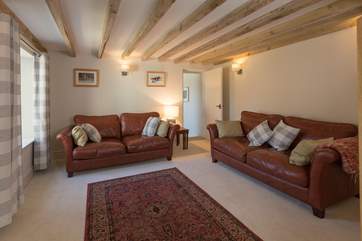 The sitting room has comfortable leather sofas and is a very tranquil room to relax in at the end of a day out on Exmoor.