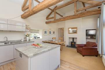 The kitchen/dining room has a wood burning stove for atmospheric evening meals.