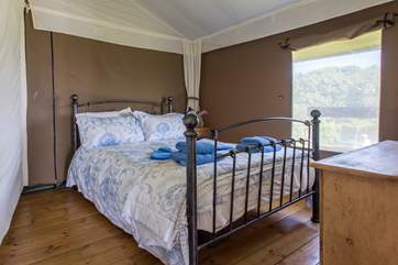 The pretty double bedroom is at the back of the tent.