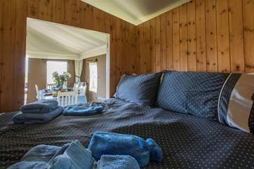 The cosy cabin bed has shutters for privacy.