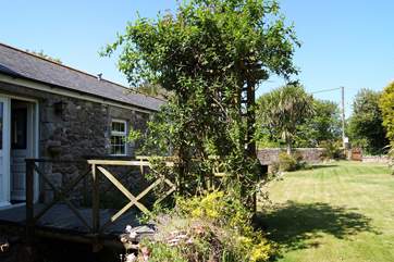 Trip trap over the bridge to the beautiful enclosed garden (please take care there is no barrier between the stream and the garden).