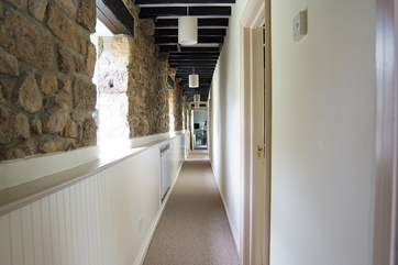 The hallway runs past the bedrooms to the sitting-room.