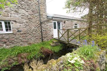 The bridge leads from the sitting-room to the garden.