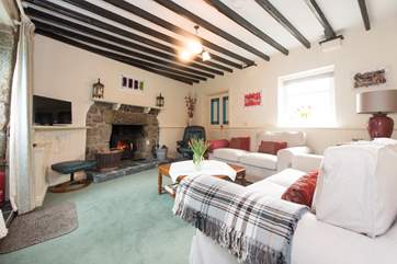 The sitting-room has a roaring wood-burner.