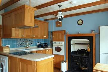 The kitchen/dining-room is small but cleverly designed and well-equipped.