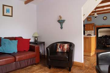 An archway leads from the sitting-room through to the kitchen/dining-room.