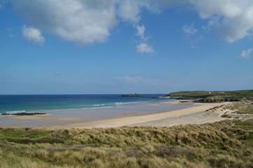Miles of golden sands stretch between Hayle beach and Godrevy lighthouse at the far end of St Ives Bay.