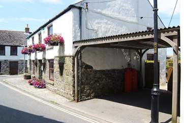 The cottage has a private covered parking space beside it.