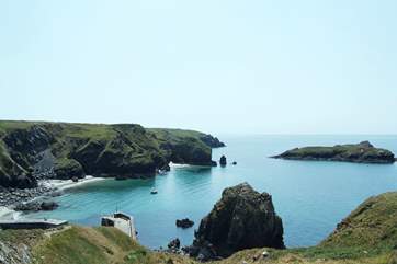 Looking down at Mullion harbour from up on the coastal footpath outside the renowned Mullion Cove Hotel.