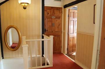 At the top of the stairs the large landing leads to the bathroom and bedrooms.