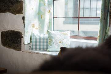 There are pretty touches throughout this lovely cottage and the window seats are just awaiting the arrival of their made-to-measure cushions.