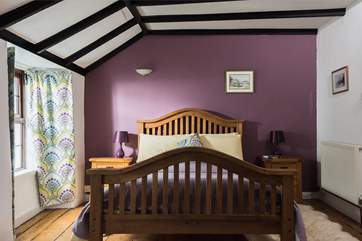 The master bedroom is furnished with a king-size 5' double bed.