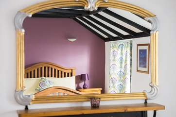 Clever cloth shutters are not only decorative but also keep out the light first thing in the morning.