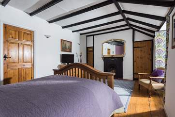 The double bedroom is unexpectedly spacious and retains many original features.