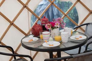 There is a table and chairs to dine inside or you can use the picnic bench on the deck outside.