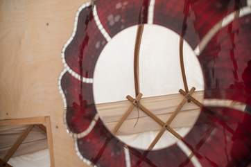 A red themed mirror for the en suite.