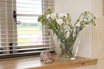 The cottage has lovely deep windowsills. This bathroom window looks out over the countryside on the edge of the village.