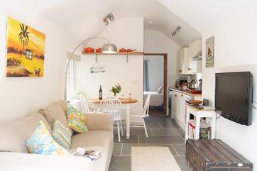 Looking back through the sitting and dining areas.