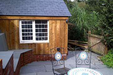 The wooden shack at Little Sandcastle is the perfect home for wetsuits, surfboards or your sandy buckets and spades!