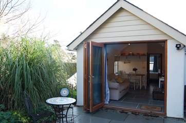 The folding glass doors bring the outside inside.