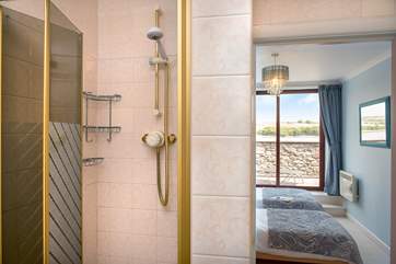 The twin bedroom has its own en suite shower-room.