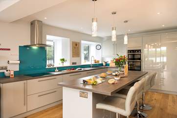 The modern kitchen has a breakfast bar ideal for enjoying a morning coffee or glass of wine whilst keeping the cook company of course!