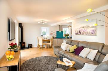 The comfy lounge area has plenty of room for everyone to chill out and the toasty woodburner makes this a perfect retreat all year round