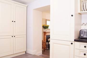 The kitchen has a wide arch through to the dining-room making this feel sociable and inclusive. Take care of the step between the two rooms.