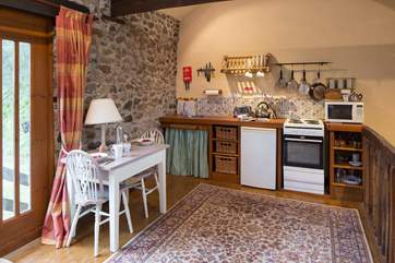 Compact kitchen/dining area.