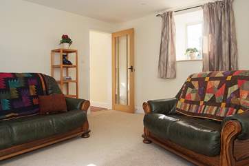 The second sitting-room is just off the entrance hall.