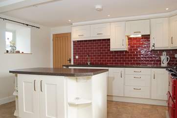 There is a separate utility-room off the kitchen with a second electric hob, washing machine and dishwasher.