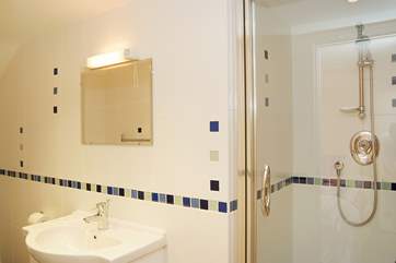 This shower-room is en suite to Bedroom 4.