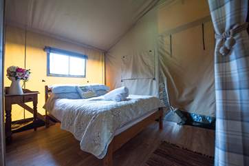 With pretty linens and a nice comfortable mattress.