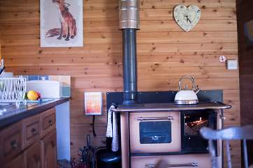 A log-fired range for your cooking and heating although there is gas stove on the front deck with two rings and grill too.