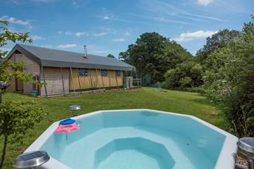 Beaver's Lodge and its wood-fired hot tub sit at the top of a gentle slope.