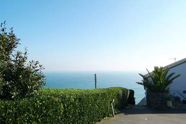 The view from the parking-area towards the steps down to the apartments and the sea beyond.