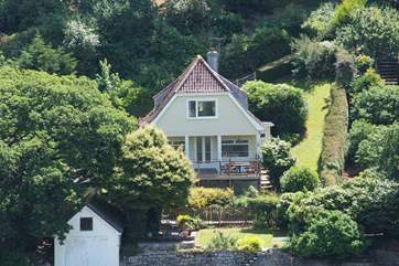 Helford House sits on the banks of this tidal river and you can spot the last section of the path down to the house with the rope railing (top right of the photo).