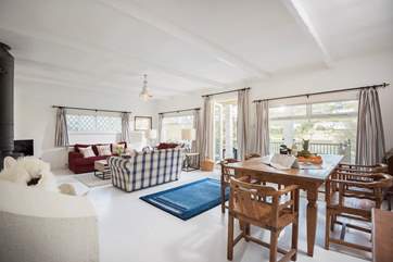 The living-room is spacious with room to relax and a choice of eating inside or out on the deck.