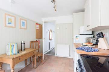 The kitchen leads onto the hallway.