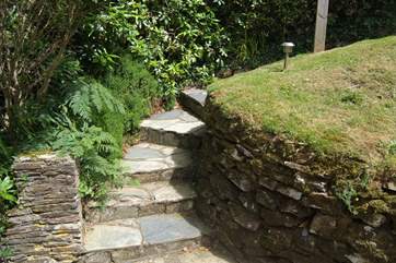 There are a few steps at both ends of the path and half way down.