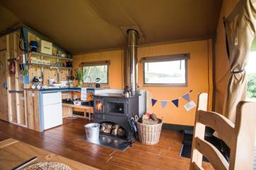 Looking towards the kitchen-area with the log-fired range (logs included) for cooking and heating.
