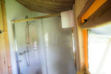Your own en suite double shower, WC and wash-basin inside the tent!