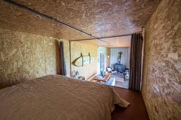 Looking from the double platform bed down the living space.