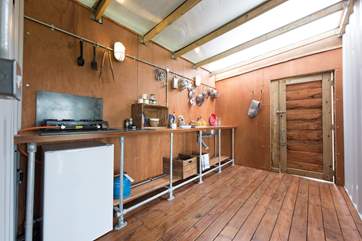 The kitchen is fully equipped including a kitchen sink!