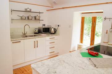 The large kitchen space is very well-equipped and has beautiful granite work surfaces.